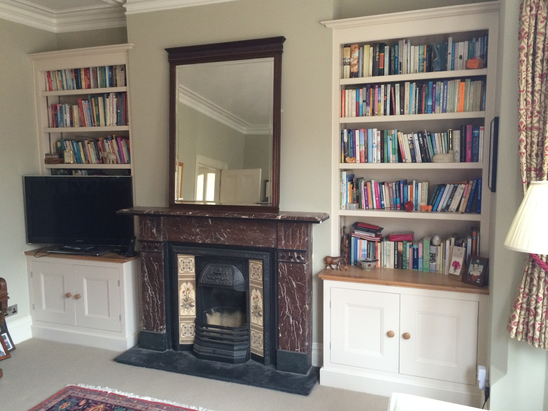 Bespoke bookcases in alcoves