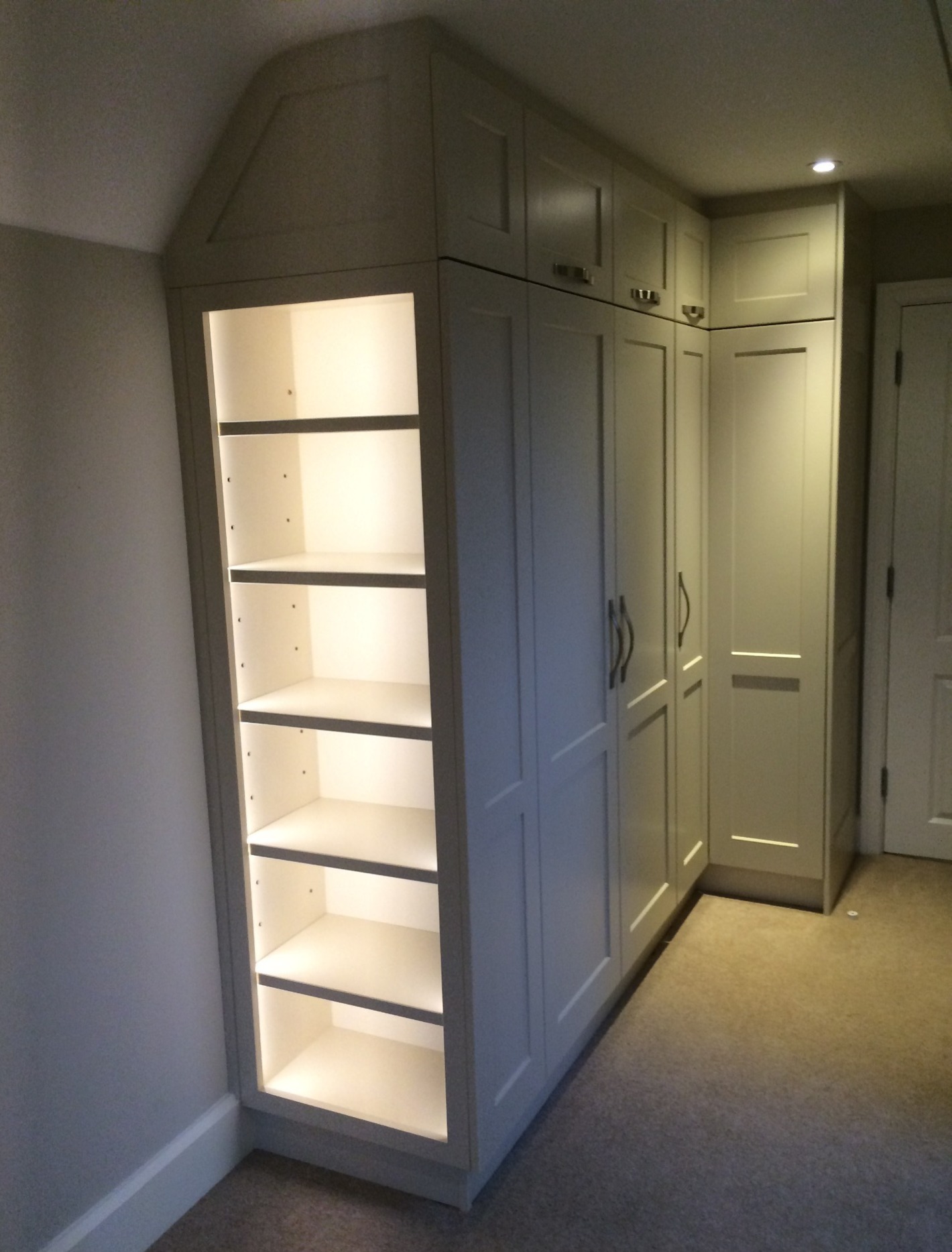 Hand-made storage with shelves and LED lighting